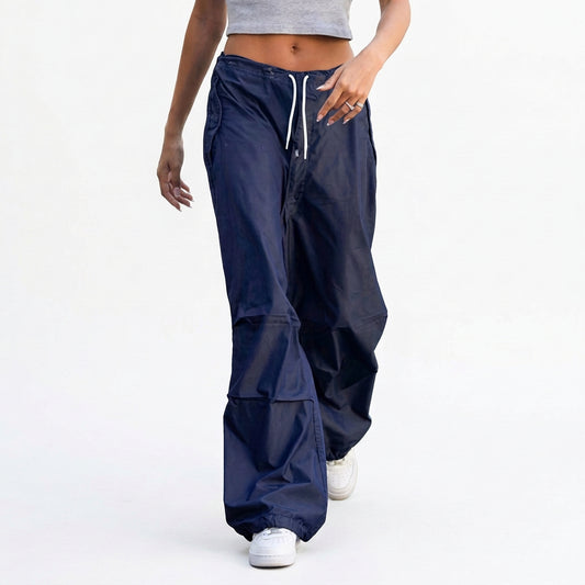 Wide leg cargo parachute pants with utility pockets and drawstring waist
