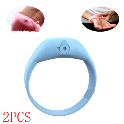 Light blue silicone hand sanitizer dispenser bracelet laid flat with two inset demonstration photos.