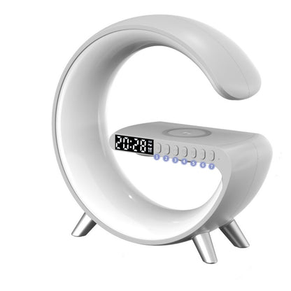 White G-shaped LED lamp with wireless charger, digital clock, and Bluetooth speaker for bedside desks.