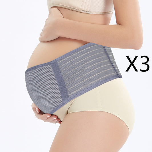 Pregnant woman wearing a grey maternity support belt with elastic bands.