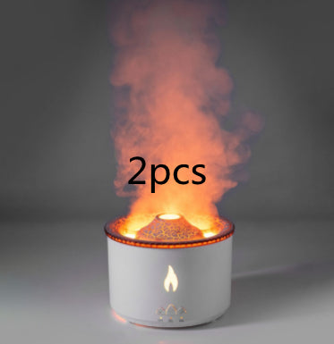 White aroma diffuser releasing orange lit mist with flame icon