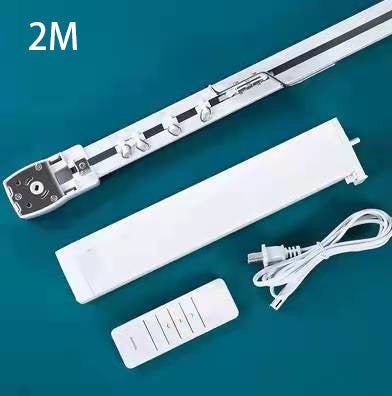 White curtain track, motor module, power cable, and remote control on a teal surface.