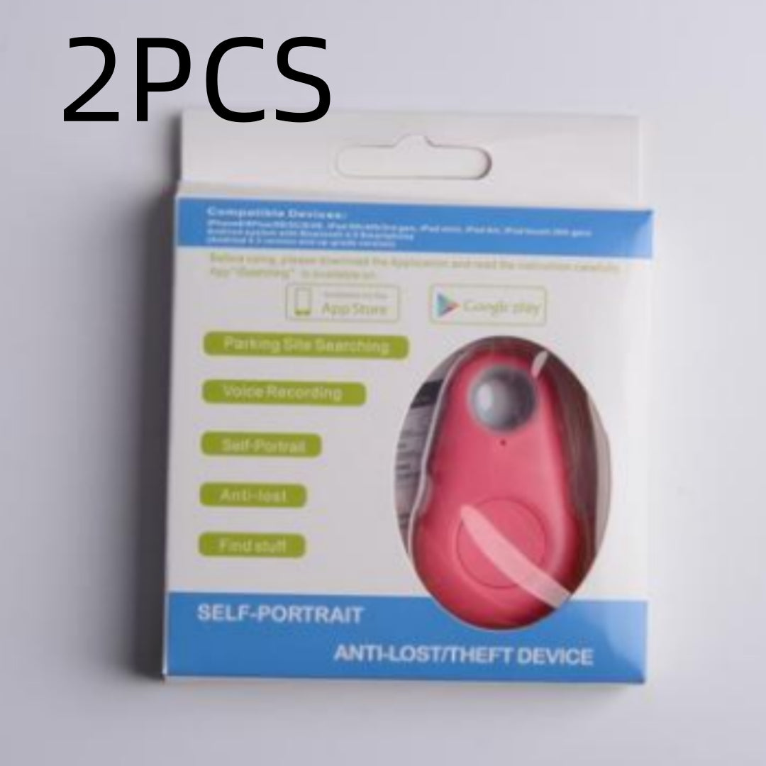 Pink waterproof Bluetooth tracker for keys and bags in white and blue retail packaging to prevent loss.