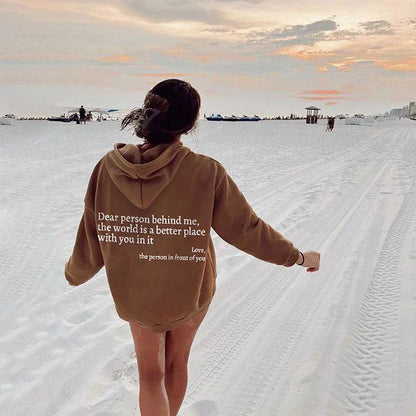 Brown oversized hoodie with white letter print and kangaroo pocket for cozy beach days.