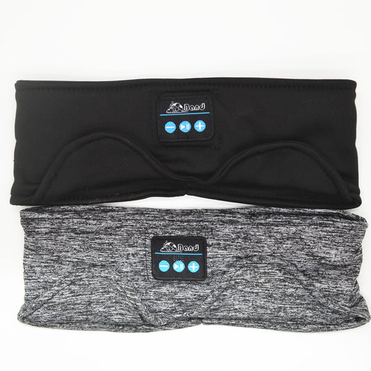 Black and grey knit sleep headband headphones with a front control panel and eye contours