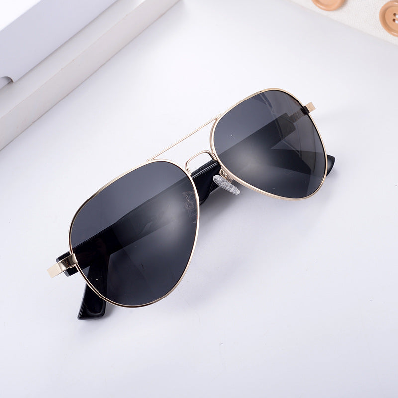 Gold metal frame aviator smart wearables with black polarized lenses for clear vision during travel and outdoor use.