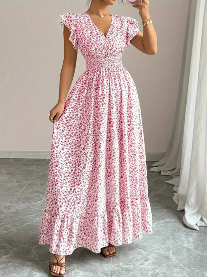 Pink floral flowy polyester dress with a V-neck, ruffle sleeves, and smocked waist for casual resortwear.