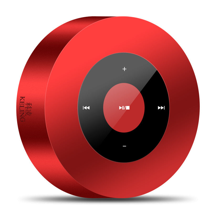 Round red bluetooth speaker with a central black control panel featuring playback buttons.