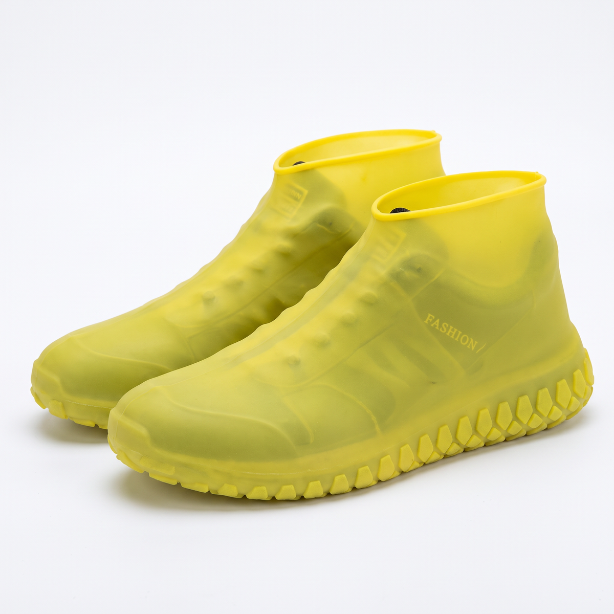 Yellow silicone waterproof shoe covers with anti-slip tread and "FASHION" text on the side.
