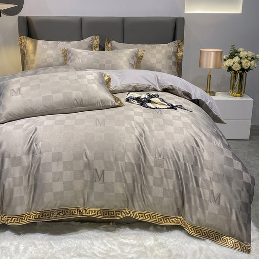 Grey checkered bed sheet set with a quilt cover, matching pillows, and a gold geometric key border.