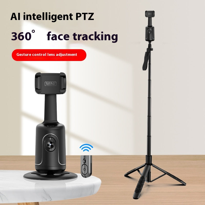Black AI face-tracking phone gimbal with remote on a table and extended on a tripod stand.