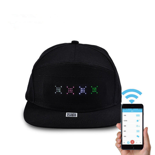 Black flat brim cap featuring a programmable LED pixel display on the front, paired with a smartphone app interface.