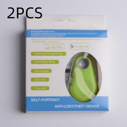 Green, teardrop-shaped waterproof Bluetooth tracker in packaging for keys and bags.