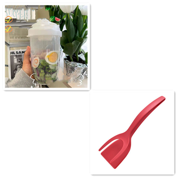 Clear plastic salad container filled with greens and egg, with a separate red spork.