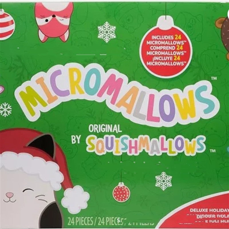 Green holiday advent calendar box with plush character graphics and ornaments.