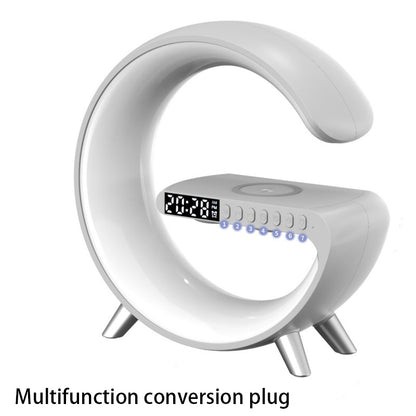 White G-shaped LED lamp with wireless charger, digital clock, and Bluetooth speaker for bedside desks.