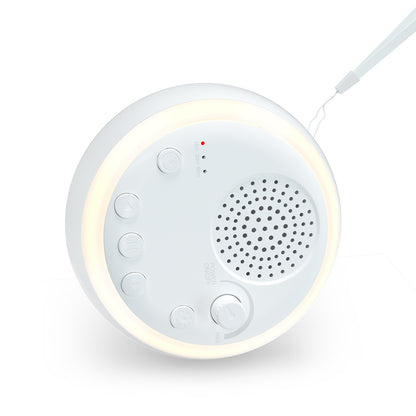 Round white sound machine with speaker grille, control buttons, volume knob, and a glowing light ring.