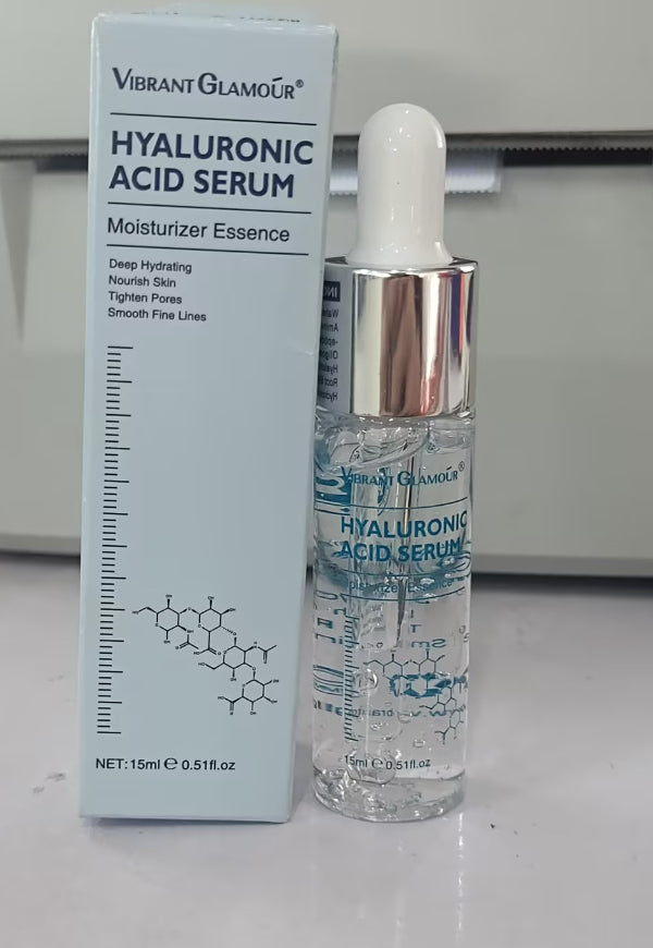 Hyaluronic acid serum bottle with dropper next to its matching product box