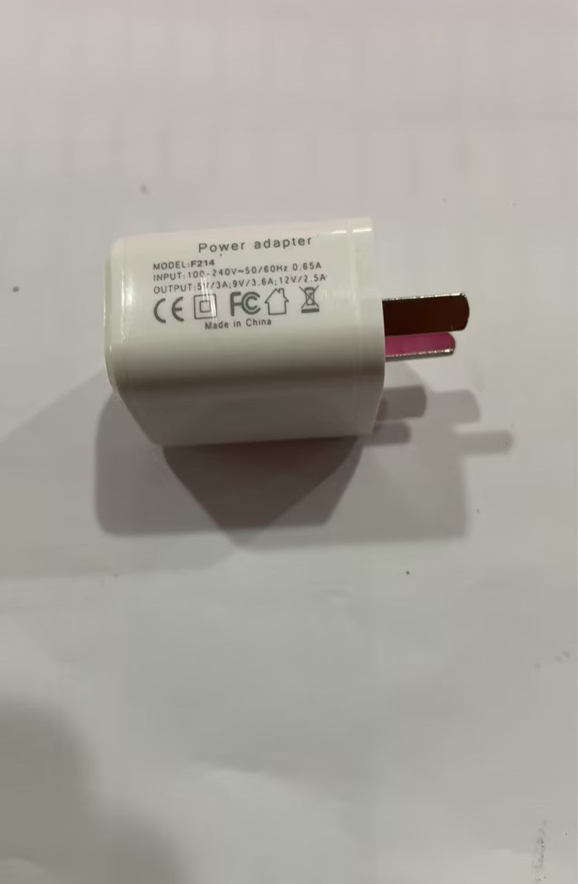 White plastic rectangular power adapter with wall plug for charging electronics.