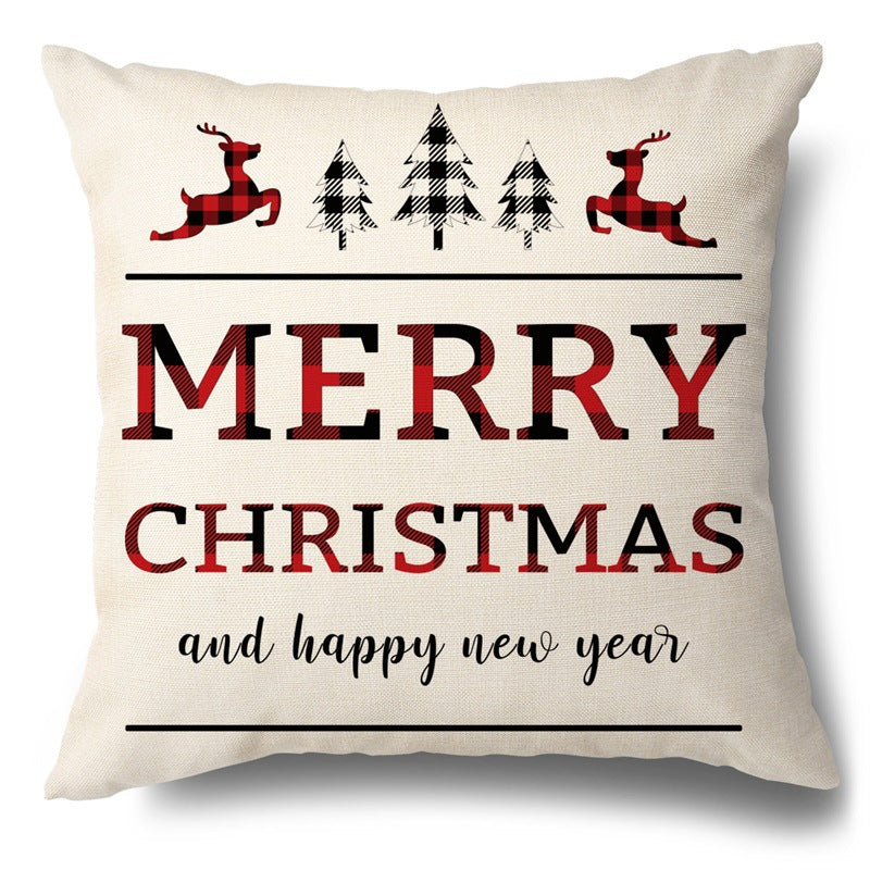 Beige pillow cover featuring MERRY CHRISTMAS text, red and black buffalo plaid reindeer, trees, and script.