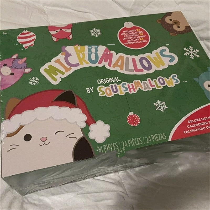 Green advent calendar box featuring holiday character illustrations and festive text.