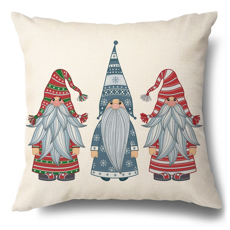 Square throw pillow cover featuring three illustrated Christmas gnomes in winter hats against a light fabric background.