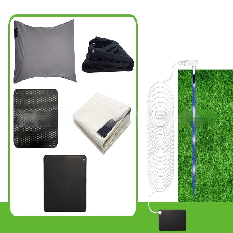 Grounding mat set including pillowcase, mats, and connecting wire plugged into ground.