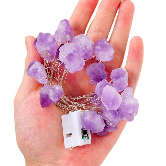 Close-up of raw crystal stones strung along the LED wire strand