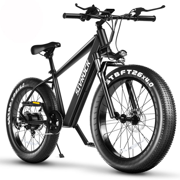 Matte black aluminum frame electric bike with fat tires for off-road trail riding.