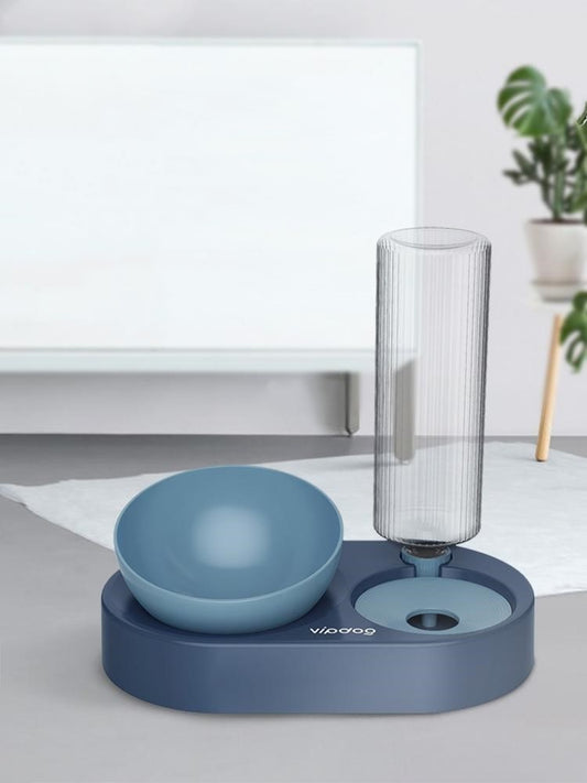 Blue pet water dispenser and feeding station with vertical bottle and bowl.