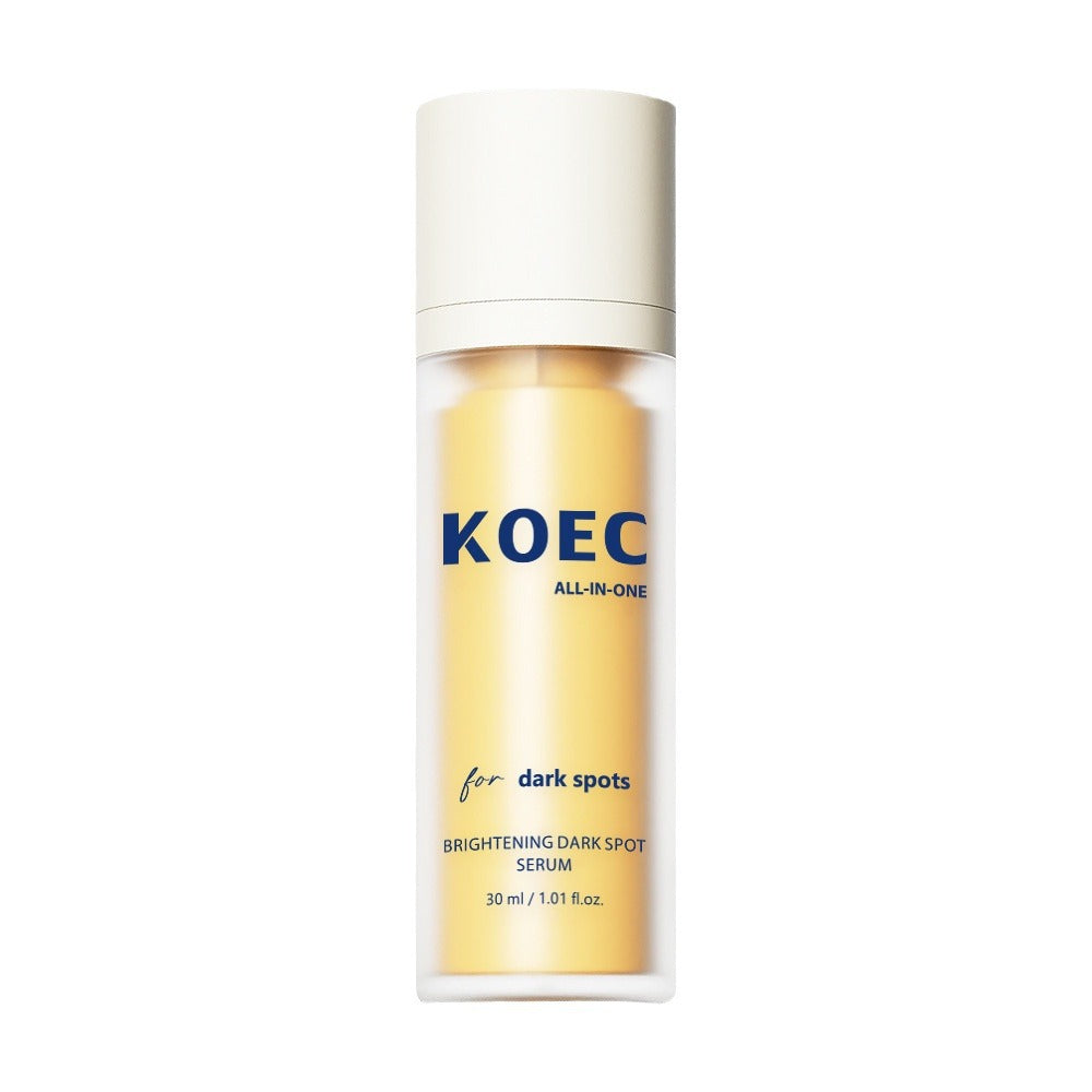 Brightening dark spot serum bottle with a white cap and yellow contents.