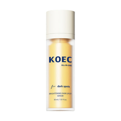Brightening dark spot serum bottle with a white cap and yellow contents.