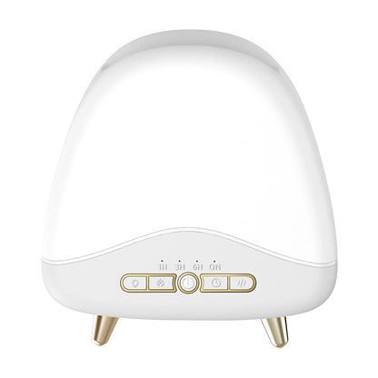 White dome aroma diffuser with gold accent buttons, timer settings, and tapered gold legs.