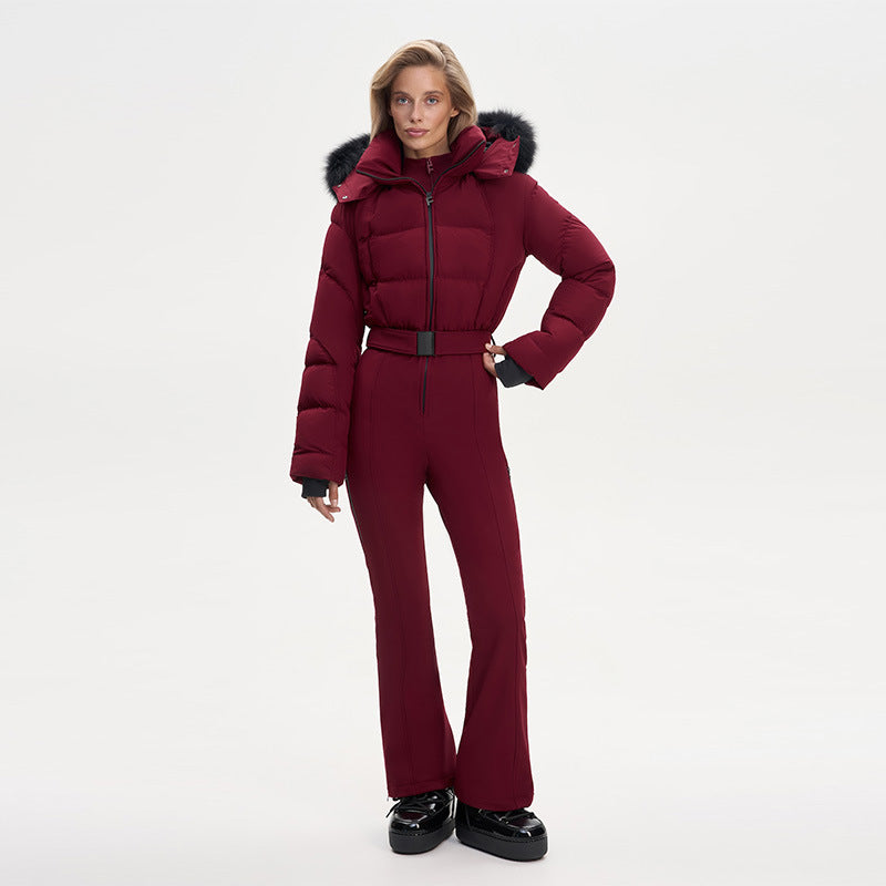 Model wearing a maroon hooded ski jumpsuit with a belt, front view