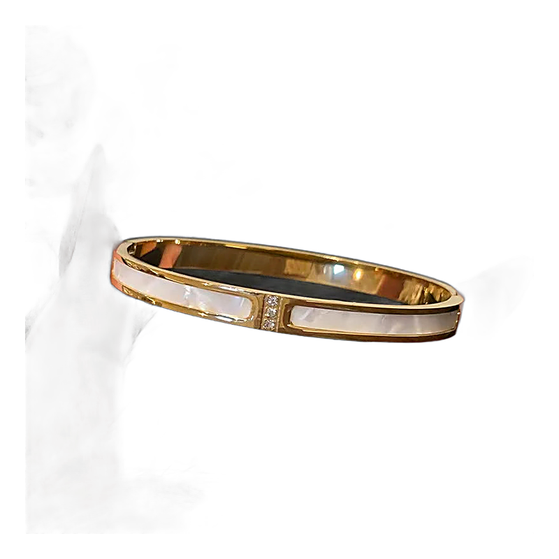 Close-up of rhinestone lines and mother-of-pearl inlay on the bangle stack, alternate view.