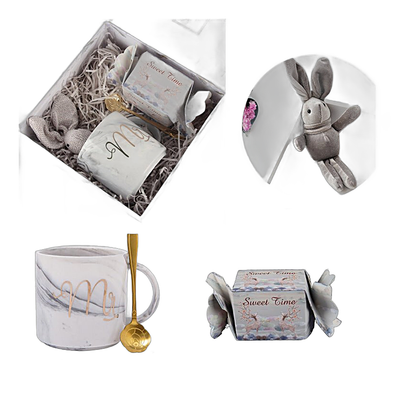 Gift set relaxation bath set featuring a ceramic mug, spoon, stuffed rabbit toy, and soap box