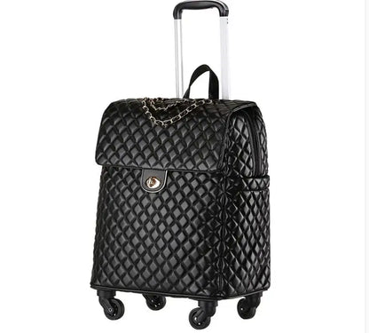 Black quilted PU leather rolling luggage with a top flap, gold turn-lock, chain detail, and telescoping handle.