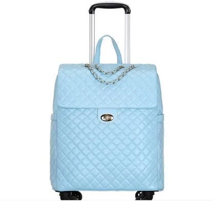 Light blue quilted PU leather rolling luggage with a top handle, chain accent, turn-lock closure, and telescoping handle.