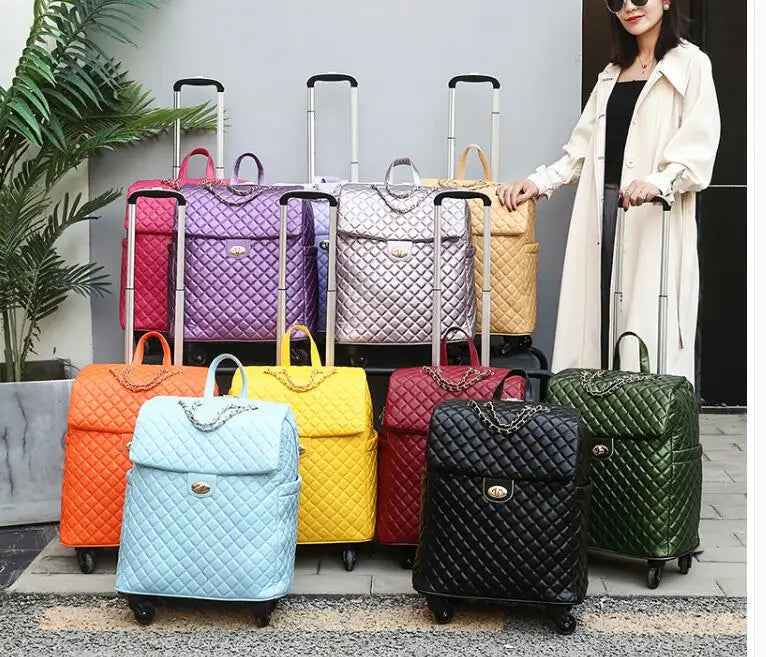 Quilted PU leather wheeled cabin trolley bags in various colors, each with a chain detail and twist lock.