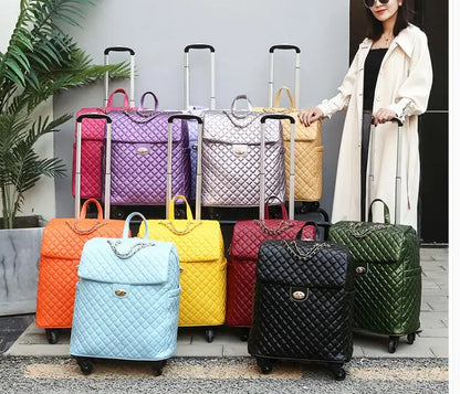 Quilted PU leather wheeled cabin trolley bags in various colors, each with a chain detail and twist lock.
