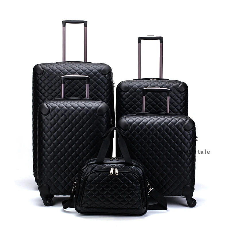 Set of four black quilted leather suitcases with retractable handles and a matching handbag.