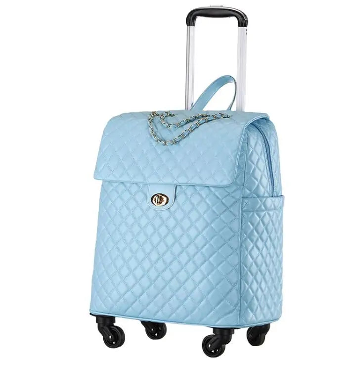 Light blue quilted PU leather rolling luggage with a chain detail, gold turn-lock, and telescopic handle.