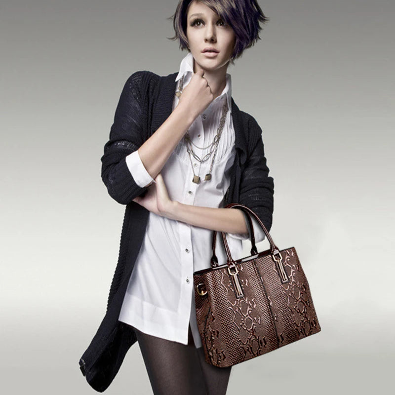 Brown snakeskin-textured structured shoulder tote with zip closure for daily essentials.
