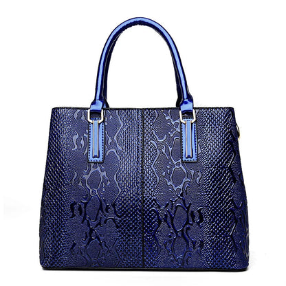 Glossy blue faux leather shoulder tote with snakeskin texture and structured design for daily office essentials.