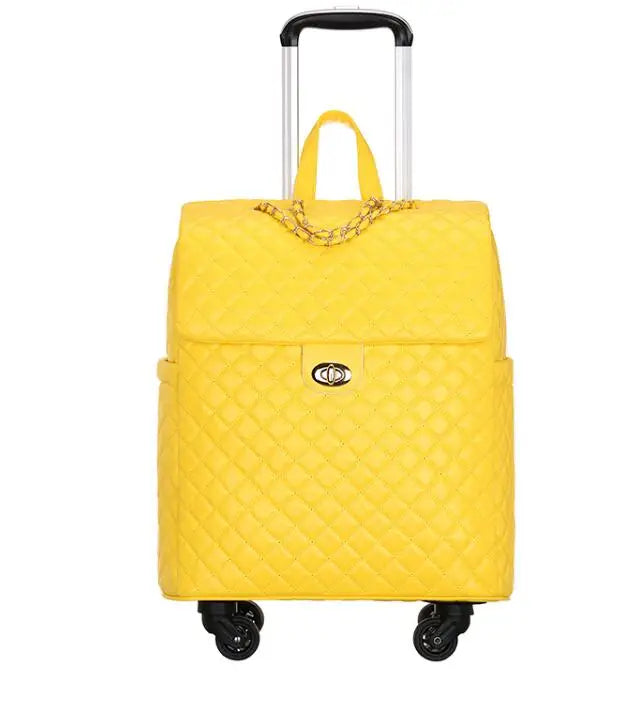 Yellow quilted PU leather rolling luggage with a flap top, gold chain detail, twist-lock closure, and retractable handle.
