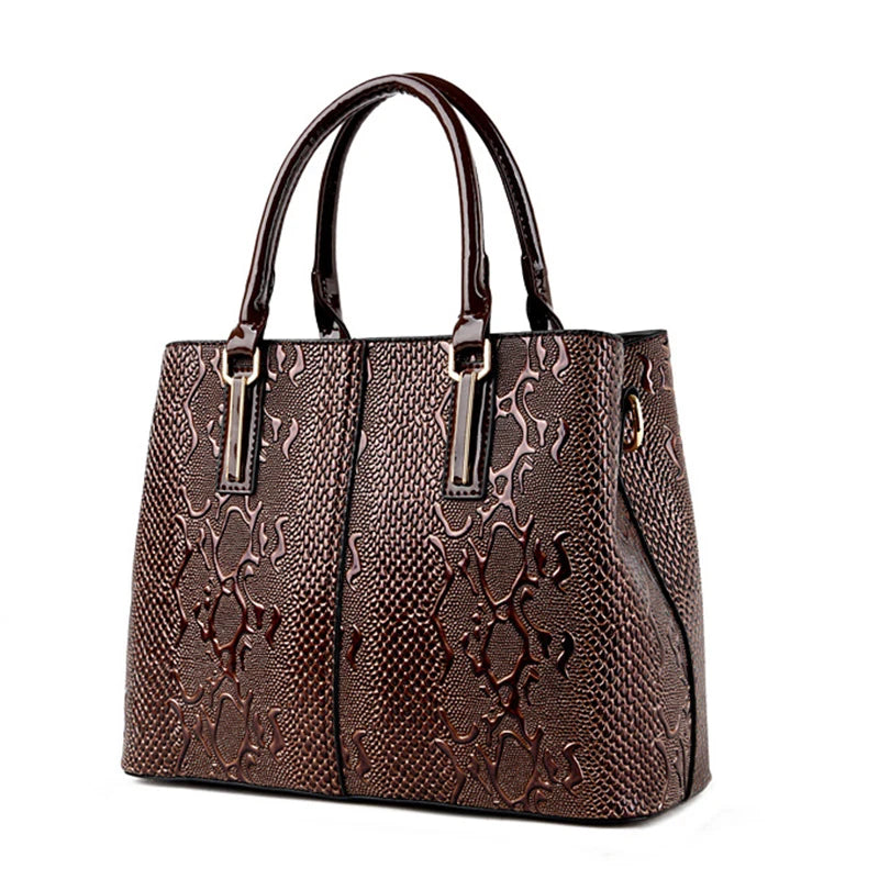 Brown, textured faux leather structured tote bag with shiny top handles for daily carry.