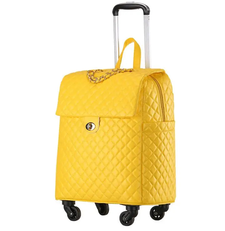 Yellow quilted PU leather wheeled cabin trolley luggage with a flap closure, gold chain detail, and telescoping handle.