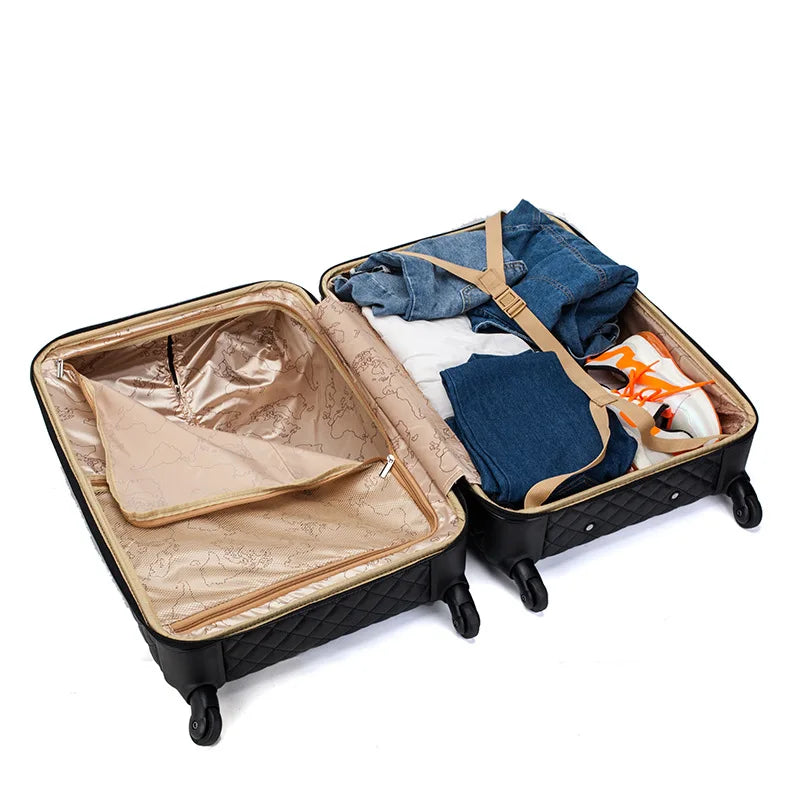 Open black quilted suitcase with gold map-print lining, packed with folded clothing and a sneaker.