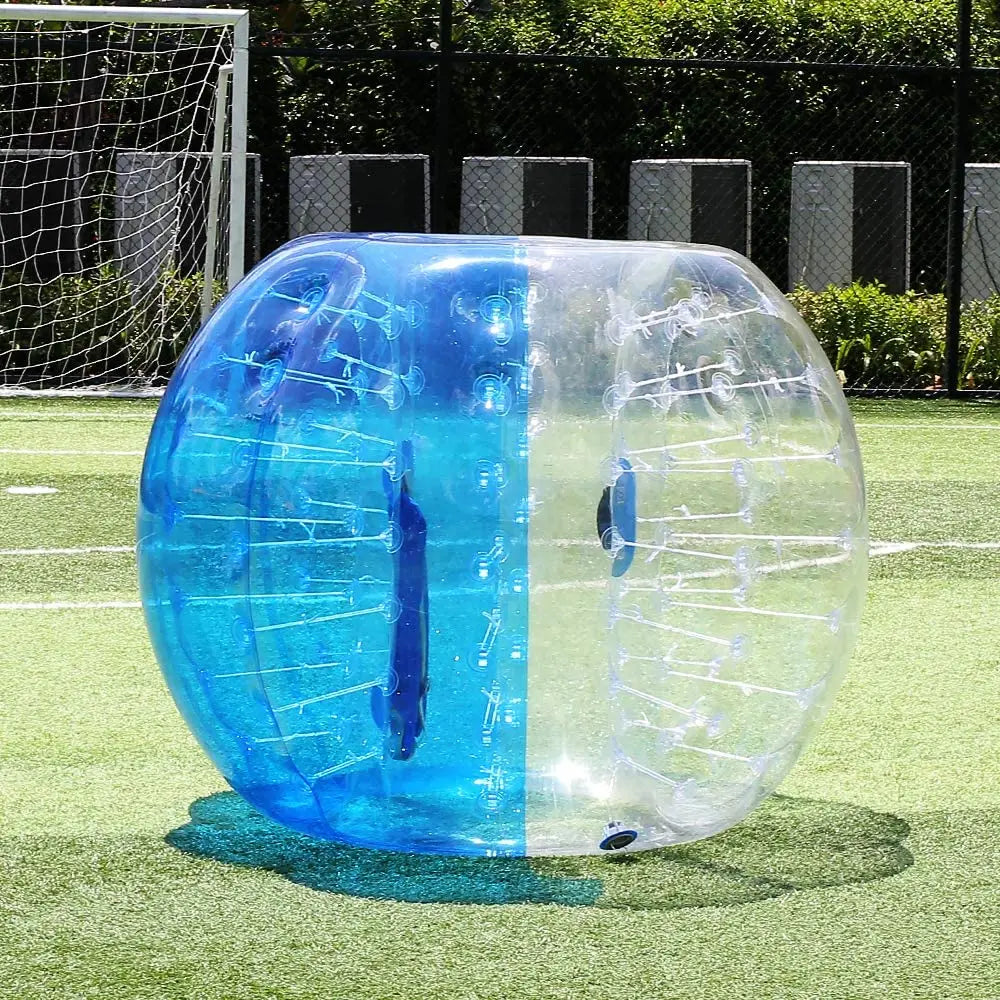 Clear and blue TPU bubble body bumper ball for safe outdoor sports and active play on a grassy field.