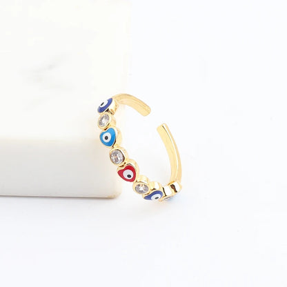 Adjustable Ring with Blue Evil Eye Open Copper Gold Tone Zircon Accent